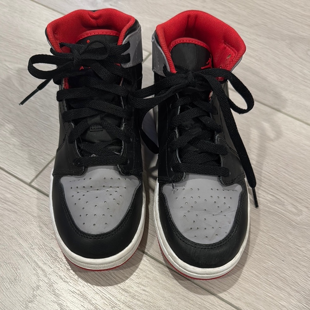 Nike Jordan’s Gray High-Top Sneakers with Red Accents